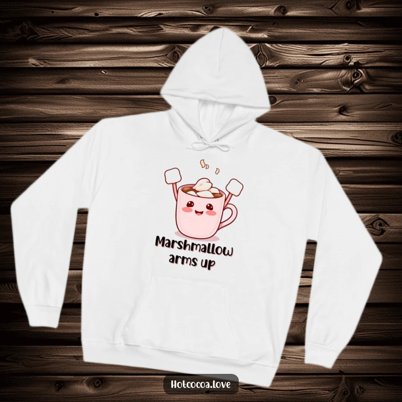 Funny hoodie showcasing a cheerful hot cocoa mug character with raised marshmallow arms, radiating warmth and playful energy.