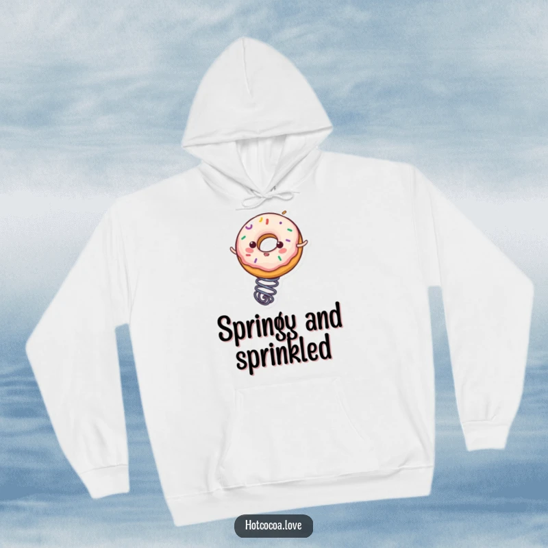 Funny donut character with sprinkles bouncing on a spring, featured on a warm and cozy hoodie, a humorous and comfortable choice.